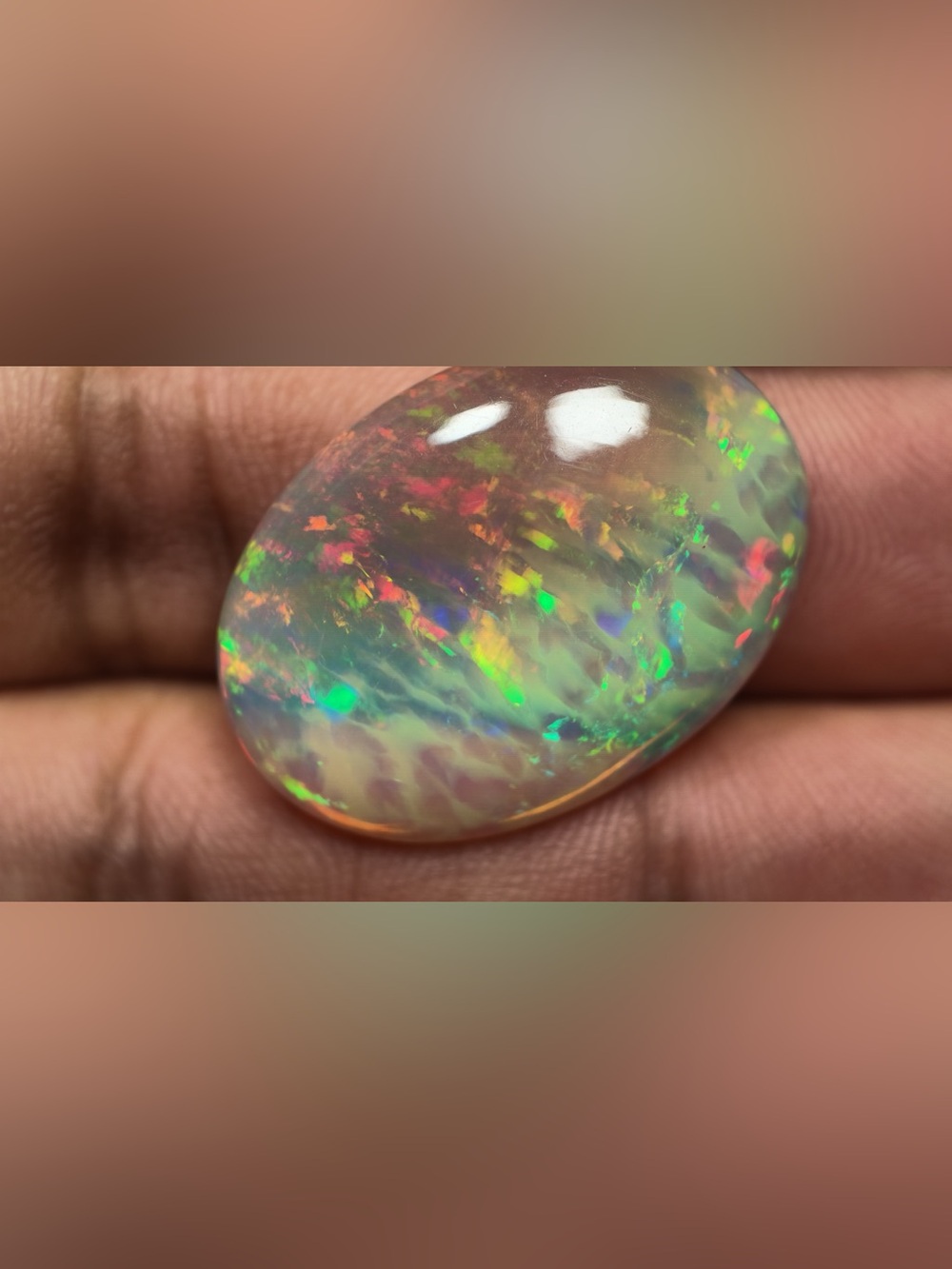 Natural Ethiopian Multicolor Opal Oval Cabochon 28.51x20.45x7.6mm